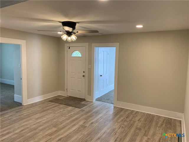 entrance foyer featuring hardwood / wood-style floors and ceiling fan