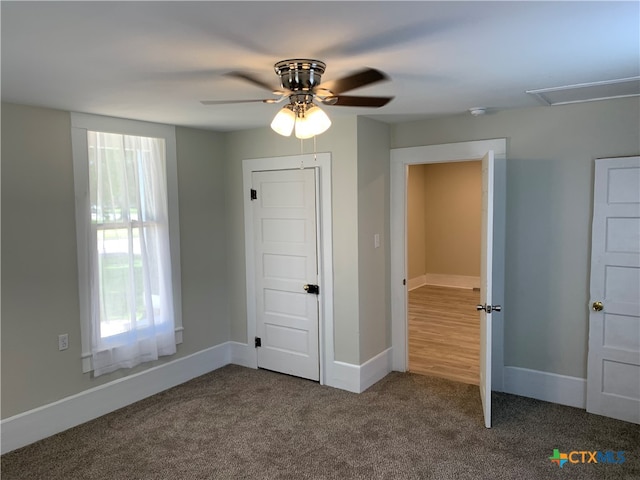 unfurnished bedroom featuring ceiling fan and carpet floors