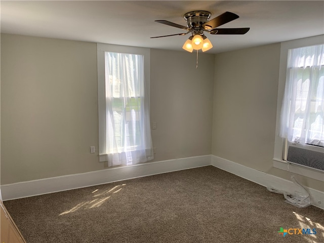 unfurnished room with carpet flooring and ceiling fan