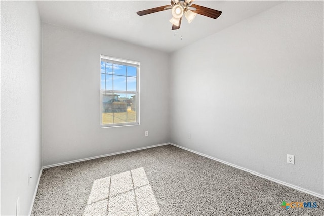 empty room with carpet floors, ceiling fan, and baseboards