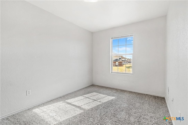 empty room featuring light colored carpet