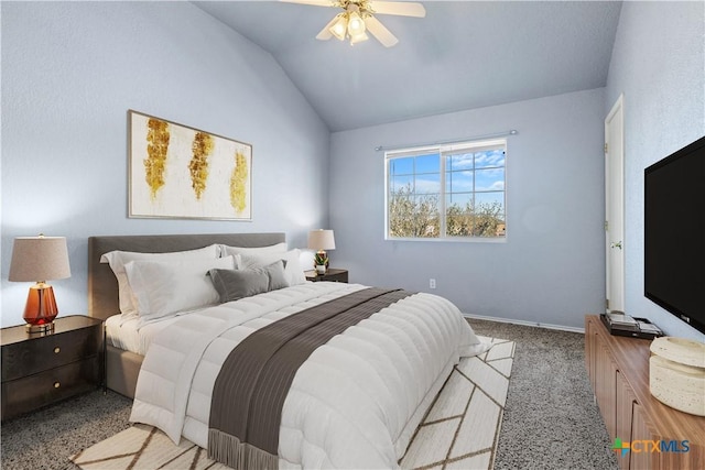 carpeted bedroom featuring lofted ceiling, a ceiling fan, and baseboards