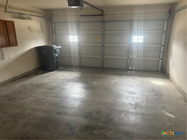 garage featuring a garage door opener