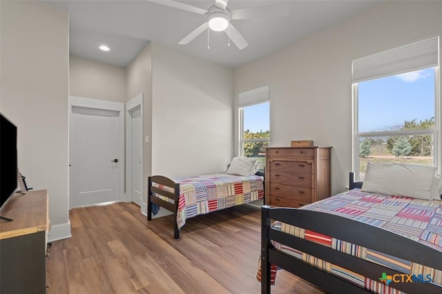 200 County Road 246, Florence, TX 76527 - bedroom with light wood-type flooring, ceiling fan, and recessed lighting