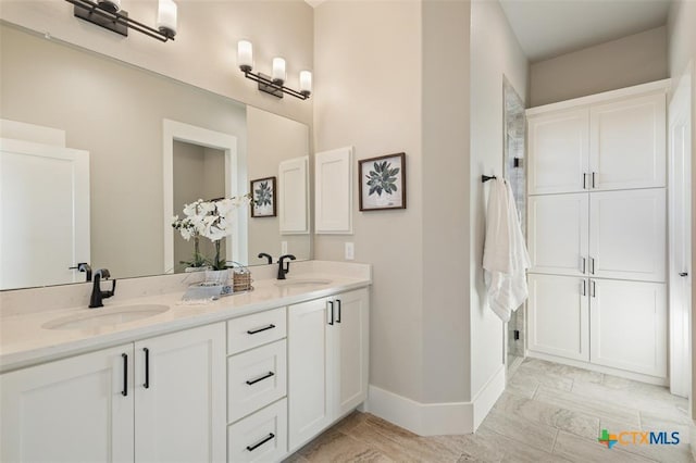 200 County Road 246, Florence, TX 76527 - full bath featuring double vanity and baseboards