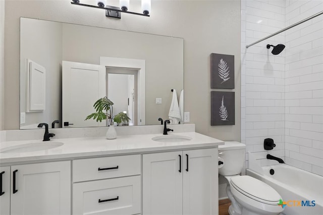 200 County Road 246, Florence, TX 76527 - bathroom featuring toilet, double vanity, and tub / shower combination