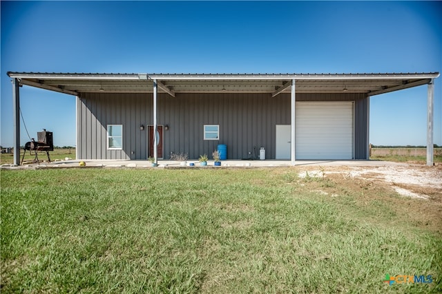 exterior space featuring a lawn and a carport