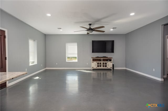 unfurnished living room with ceiling fan