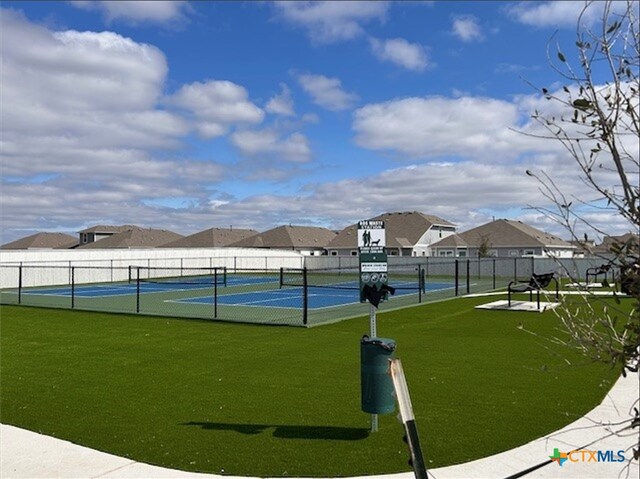 3035 Winding Creek Rd, Kyle, TX 78640 - view of tennis court featuring a residential view