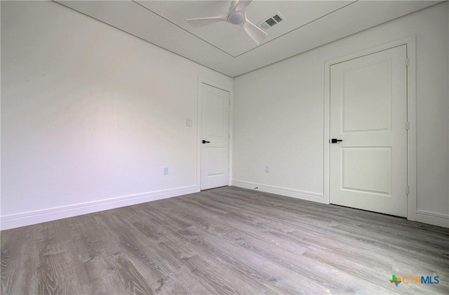 3104 Zephyr Rd, Killeen, TX 76543 - unfurnished bedroom featuring wood finished floors, baseboards, and a ceiling fan