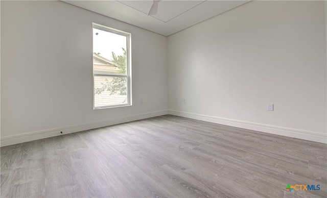 3104 Zephyr Rd, Killeen, TX 76543 - unfurnished room featuring plenty of natural light, wood finished floors, and baseboards