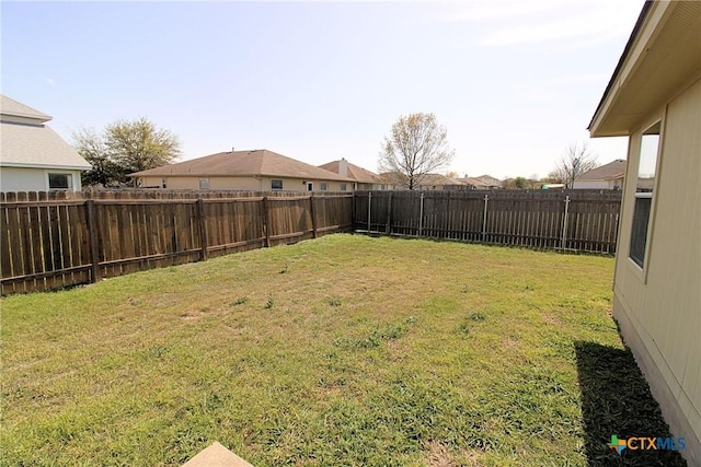 view of yard featuring a fenced backyard