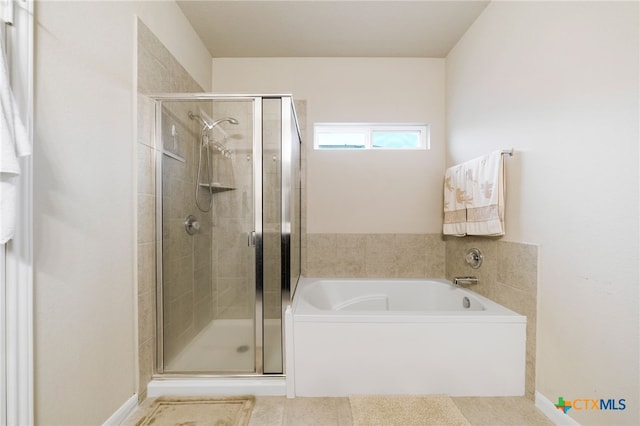 bathroom featuring separate shower and tub and tile patterned floors