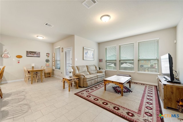 living room with light tile patterned floors