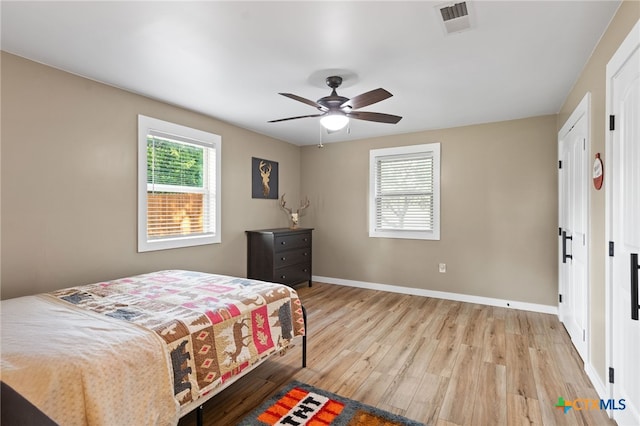 151 Crest Circle Dr, San Marcos, TX 78666 - bedroom featuring light wood finished floors, baseboards, and a ceiling fan