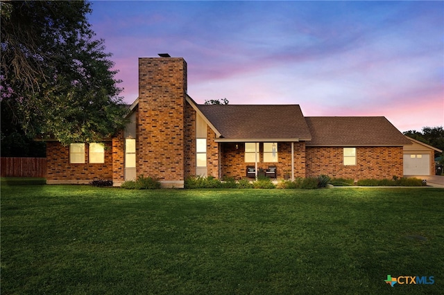 151 Crest Circle Dr, San Marcos, TX 78666 - view of front of house featuring a chimney, an attached garage, brick siding, and roof with shingles