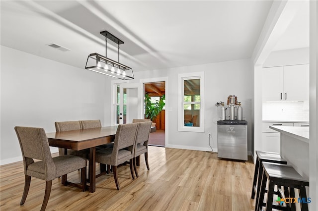 151 Crest Circle Dr, San Marcos, TX 78666 - dining room featuring light wood-style flooring, baseboards, and french doors