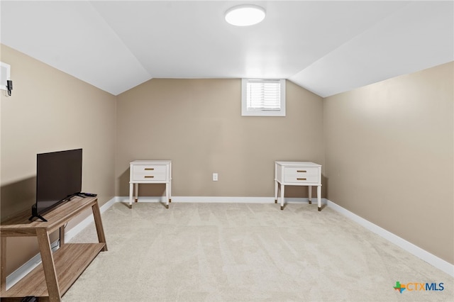 151 Crest Circle Dr, San Marcos, TX 78666 - additional living space with light colored carpet, vaulted ceiling, and baseboards