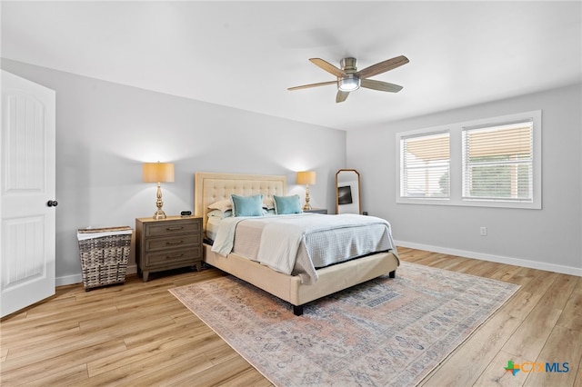 151 Crest Circle Dr, San Marcos, TX 78666 - bedroom with light wood-style floors, baseboards, and a ceiling fan