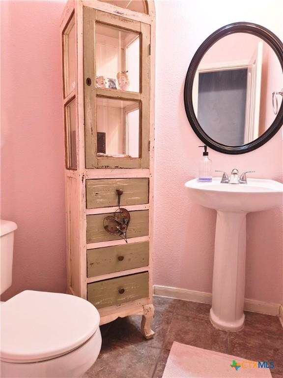 bathroom with toilet and sink