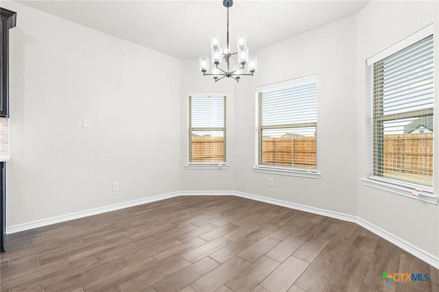 empty room with an inviting chandelier