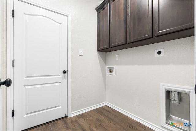 washroom with hookup for a washing machine, dark hardwood / wood-style floors, hookup for an electric dryer, and cabinets