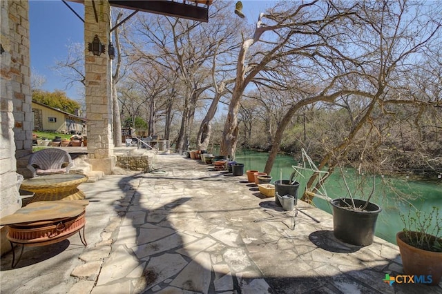 view of patio / terrace featuring a water view