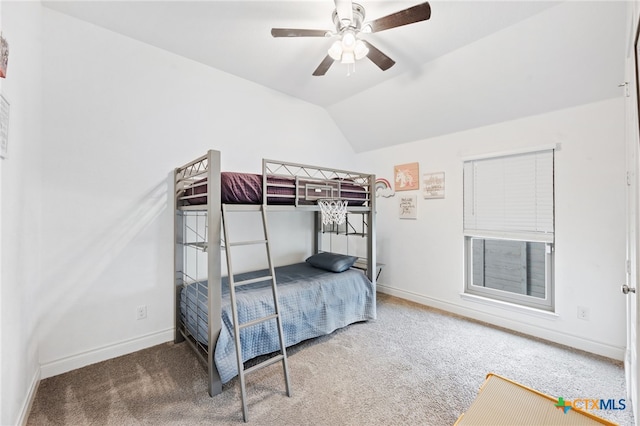 bedroom featuring baseboards, lofted ceiling, ceiling fan, and carpet