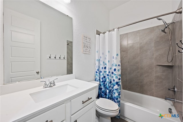 bathroom featuring toilet, vanity, and shower / bath combo