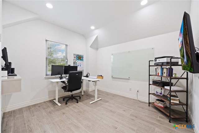 office with baseboards, lofted ceiling, and wood finished floors
