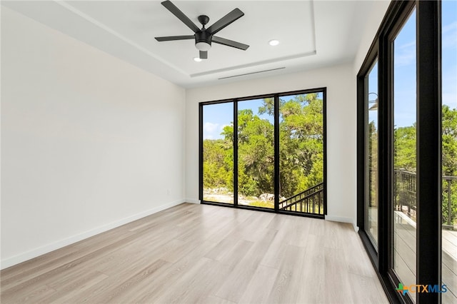2637 Campestres, Spring Branch, TX 78070 - empty room featuring light wood-type flooring, ceiling fan, a raised ceiling, recessed lighting, and baseboards