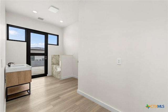 2637 Campestres, Spring Branch, TX 78070 - hall with baseboards, light wood-type flooring, recessed lighting, and a sink