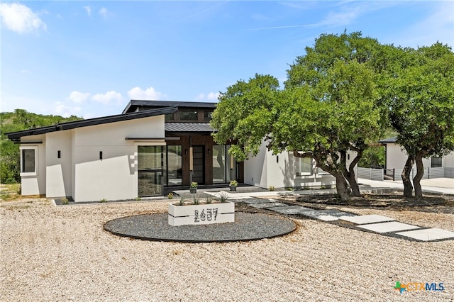 2637 Campestres, Spring Branch, TX 78070 - back of property with stucco siding, metal roof, and a standing seam roof