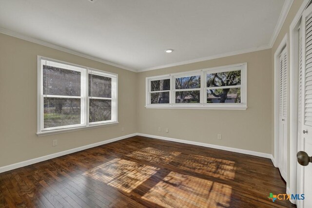 unfurnished room featuring crown molding and dark hardwood / wood-style floors