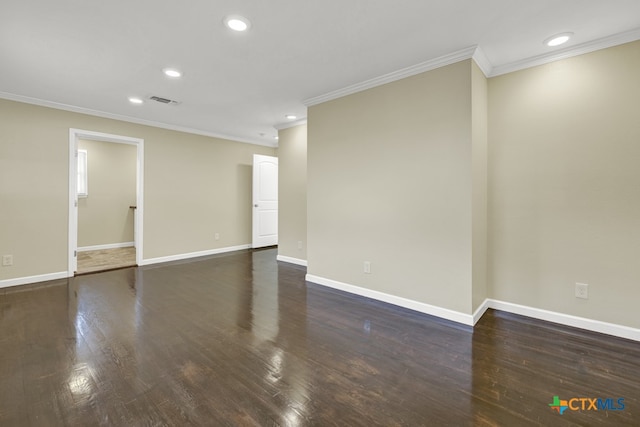 spare room with crown molding and dark hardwood / wood-style floors