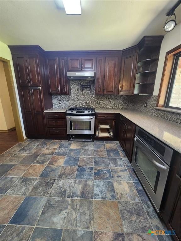 kitchen featuring backsplash, dark brown cabinetry, oven, and stainless steel gas range oven