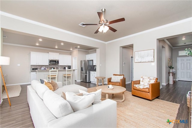 10207 Six Shooter Ln, Temple, TX 76502 - living area featuring ornamental molding, a ceiling fan, dark wood-style floors, baseboards, and recessed lighting