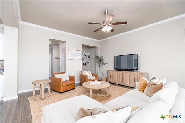 10207 Six Shooter Ln, Temple, TX 76502 - living room featuring wood finished floors, ornamental molding, a ceiling fan, and baseboards