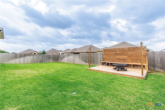 10207 Six Shooter Ln, Temple, TX 76502 - view of yard with a deck and an outdoor fire pit