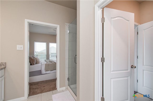 10207 Six Shooter Ln, Temple, TX 76502 - ensuite bathroom with a shower stall, baseboards, and vanity