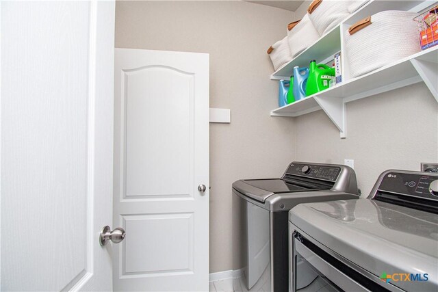 10207 Six Shooter Ln, Temple, TX 76502 - clothes washing area featuring washing machine and clothes dryer