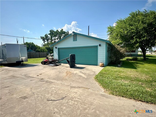 garage with a lawn