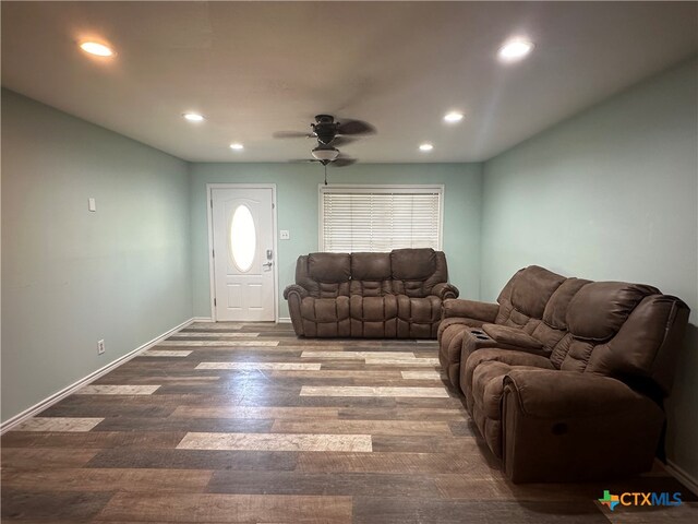 living room with hardwood / wood-style floors and ceiling fan