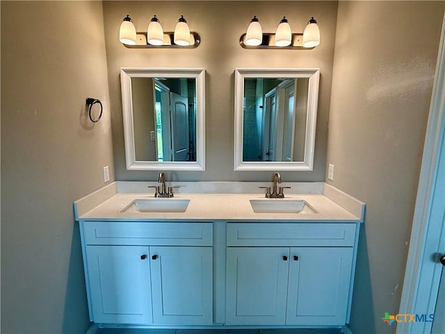 bathroom featuring double vanity and a sink