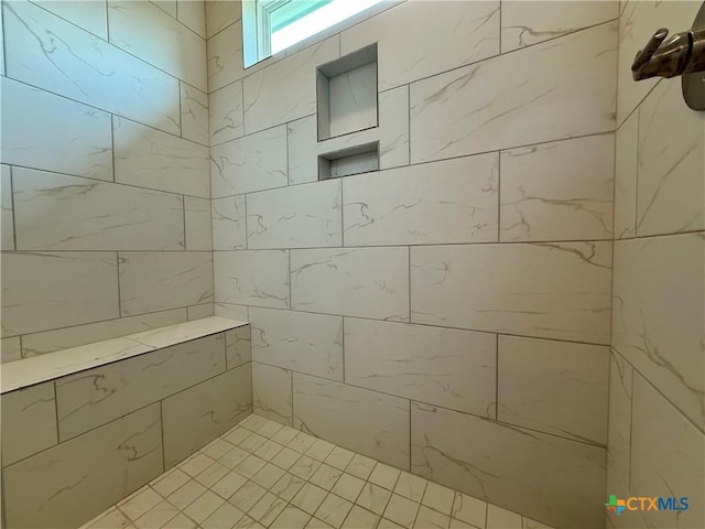 full bathroom with tiled shower