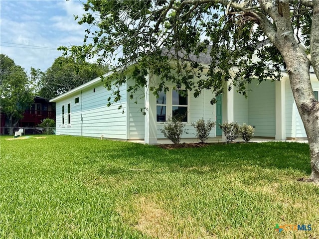 view of home's exterior featuring a lawn