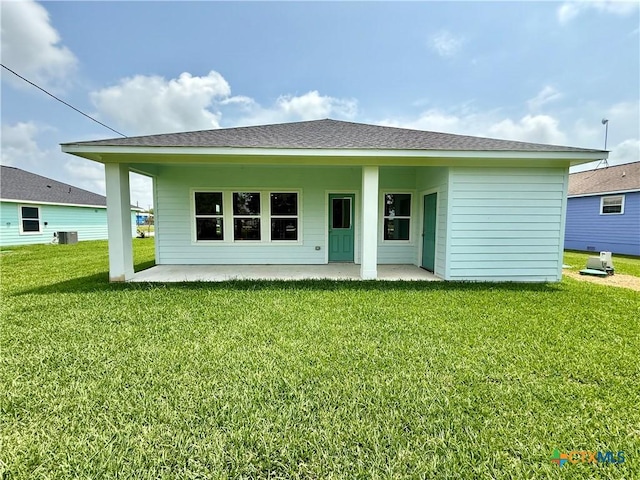back of house with a lawn, central AC, and a patio area