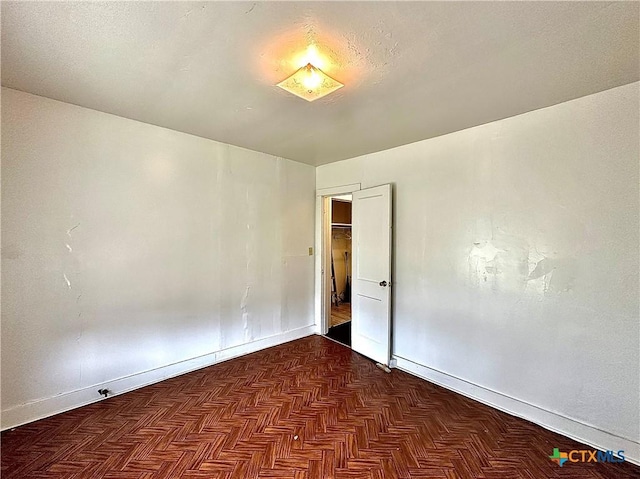 empty room with baseboards