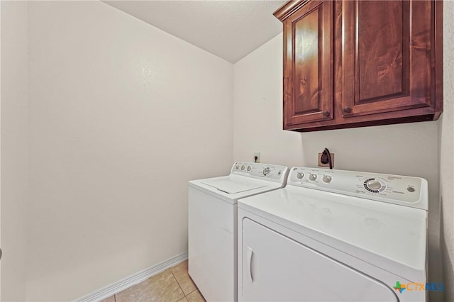 519 Gianotti Ct, Temple, TX 76502 - washroom with cabinet space, washing machine and dryer, and light tile patterned floors