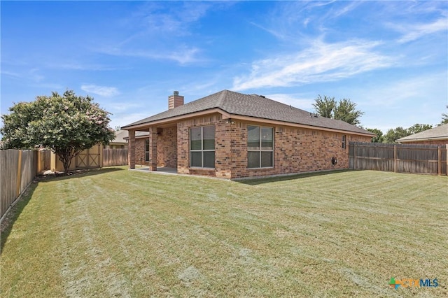 519 Gianotti Ct, Temple, TX 76502 - back of property with brick siding, a chimney, and a fenced backyard